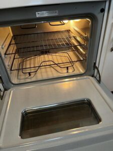 A sparkling clean oven interior with racks after professional cleaning by Jenny Can Cleaning Company in Canton, OH