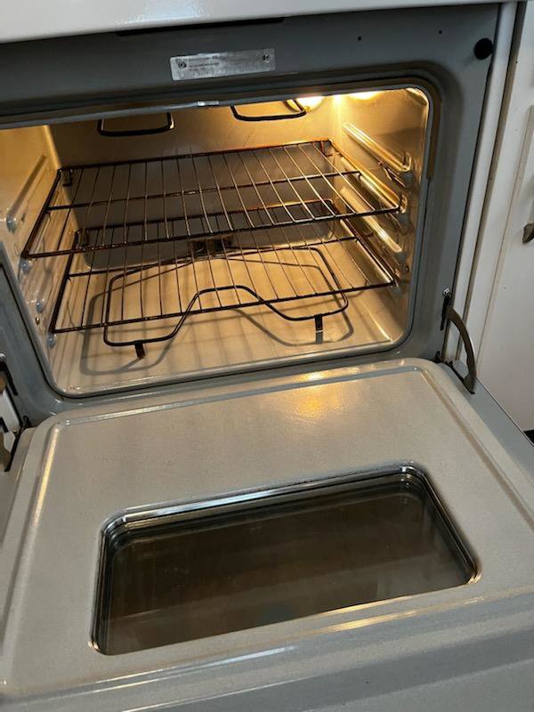 A sparkling clean oven interior with racks after professional cleaning by Jenny Can Cleaning Company in Canton, OH