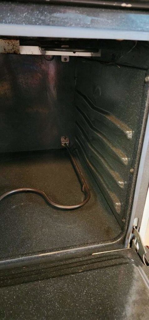 A sparkling clean oven interior with racks removed, showcasing the deep cleaning services provided by Sparkle & Shine of Iowa in Urbandale, IA.