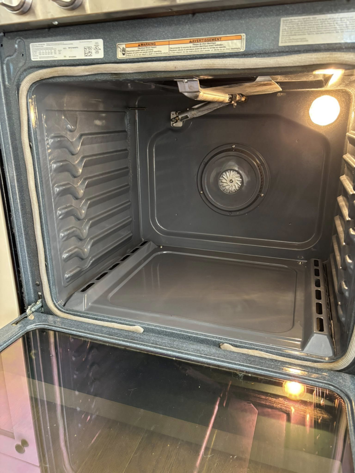 The sparkling clean interior of an oven after professional cleaning by Tidy Townhouses in Manchester, NH.