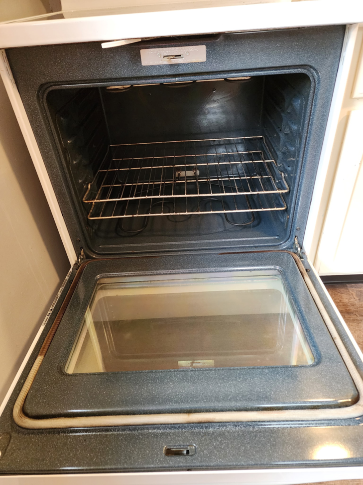 A sparkling clean oven interior, showcasing the detailed cleaning services by Christina's Tidy Homes in Canton, OH.