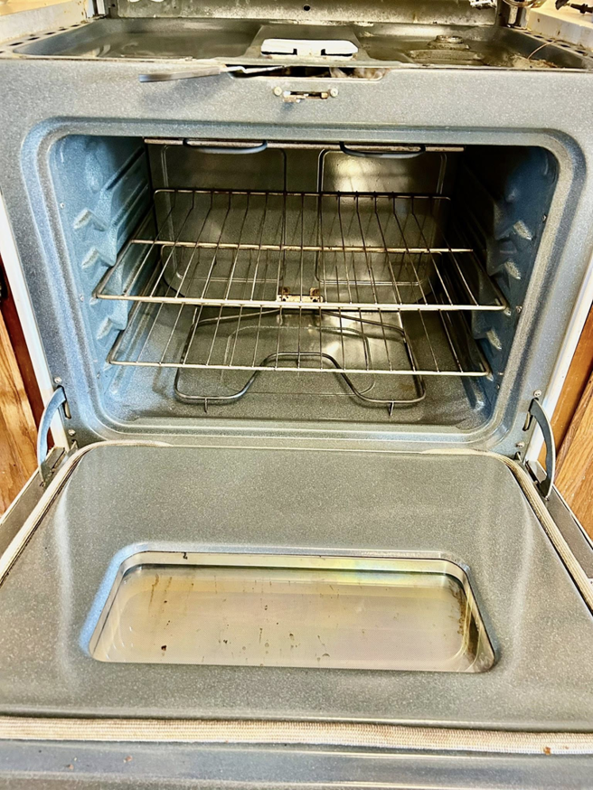 The clean interior of an oven with racks, demonstrating the thorough cleaning services provided by Elite A&C Cleaning, LLC in Casper, WY.