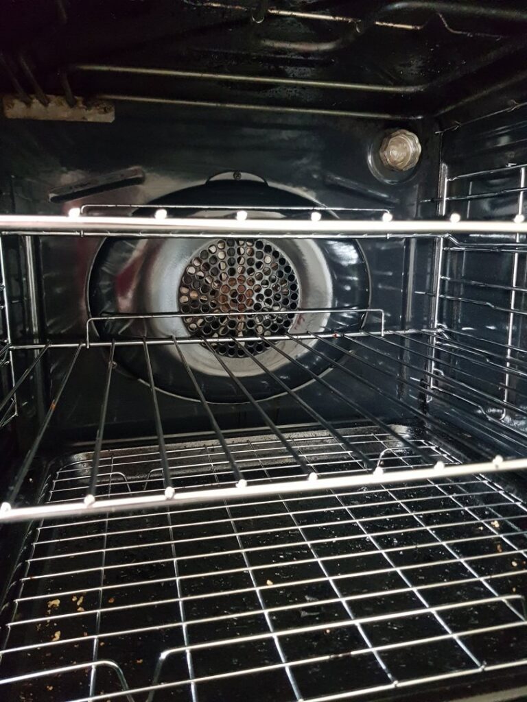 A sparkling clean oven interior with polished racks, showcasing professional oven cleaning by Pretty & Polished Cleaning Services in Sandy, OR.