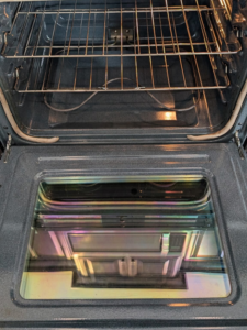 A sparkling clean oven interior with shiny racks, showcasing the results of White Rose Cleaning in Idaho Falls, ID.