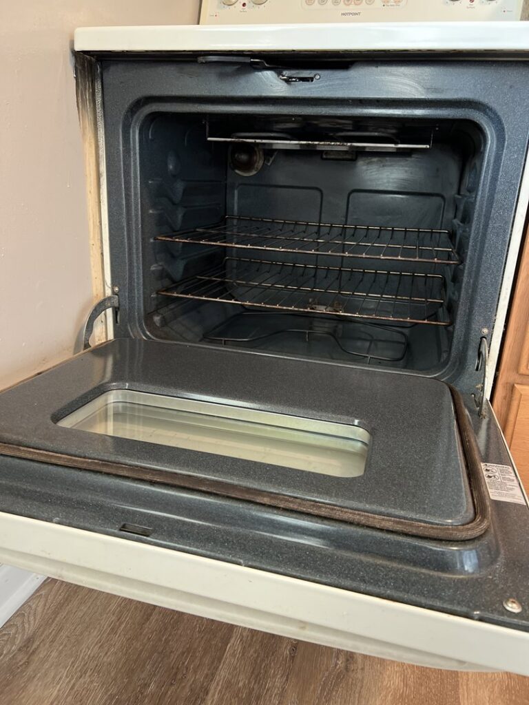 A thoroughly cleaned oven interior with racks, by Whole New World Cleaning Service, LLC in Wilmington, DE