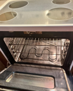 A sparkling clean oven after a professional deep cleaning by Mama's Touch Cleaning Service LLC in Evansville, IN.
