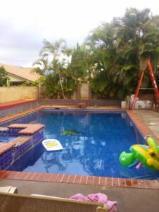 A clean pool skimmer basket well after debris removal, showcasing thorough maintenance by Aloha Pool Cleaning LLC in Las Vegas, NV.