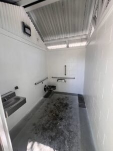 A clean public restroom interior after professional cleaning by EB Restorations & Cleaning Services in Sparks, NV