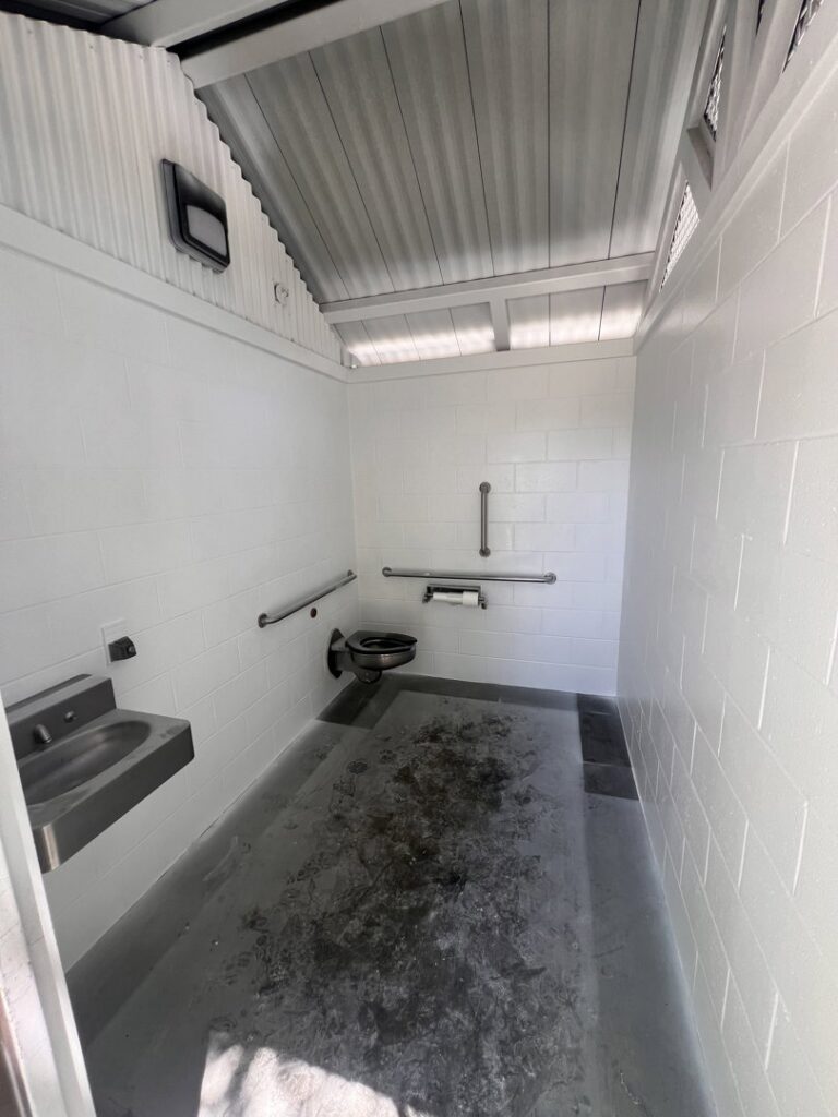 A clean public restroom interior after professional cleaning by EB Restorations & Cleaning Services in Sparks, NV