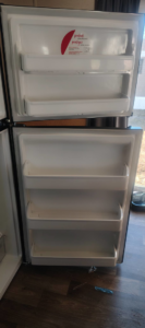 The sparkling clean interior of a refrigerator door, expertly cleaned by Last Chance cleaning service in Dothan, AL.