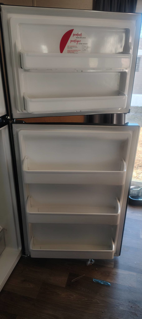 The sparkling clean interior of a refrigerator door, expertly cleaned by Last Chance cleaning service in Dothan, AL.