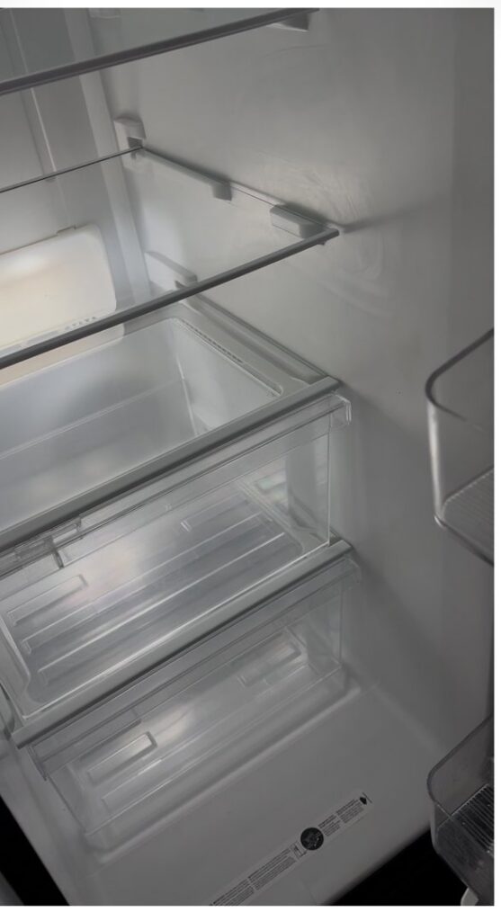 Clean refrigerator drawers and interior, showcasing the excellent cleaning results by Bee-Dazzled Cleaning Service in Long Beach, CA.