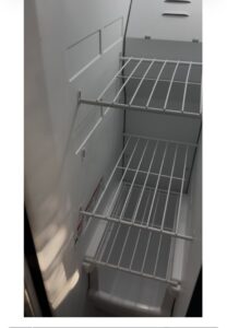 A sparkling clean refrigerator interior with shelves, demonstrating the quality cleaning by Bee-Dazzled Cleaning Service in Long Beach, CA.