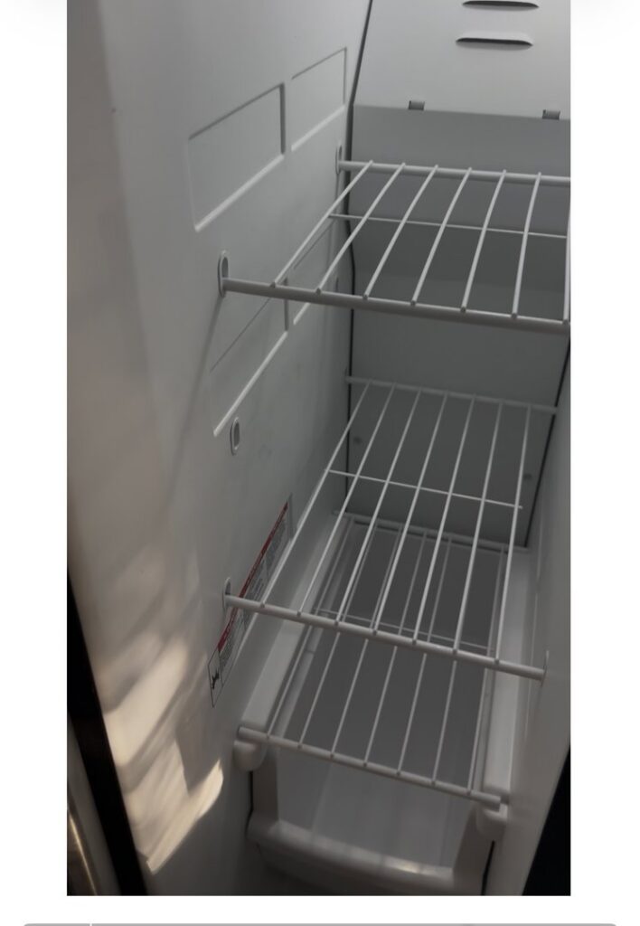 A sparkling clean refrigerator interior with shelves, demonstrating the quality cleaning by Bee-Dazzled Cleaning Service in Long Beach, CA.