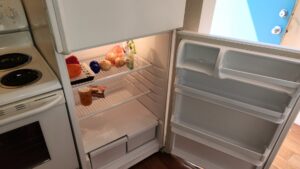 The clean and organized interior of a refrigerator, demonstrating the detailed cleaning services provided by Eyedeal Cleaning Services in Gresham, OR.