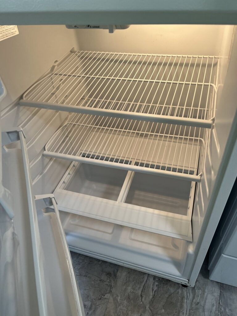 The clean and empty interior of a refrigerator, showcasing appliance cleaning by Final Touch & More in Fort Wayne, IN