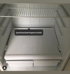 A sparkling clean refrigerator interior after professional cleaning by Juanita's Cleaning Services LLC in Gulfport, MS.