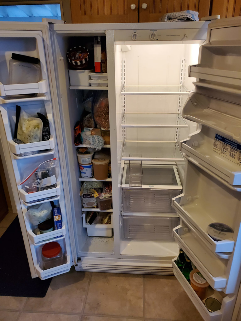 A sparkling clean interior of a refrigerator, showcasing deep cleaning services by Quickcleanup full service cleaning in Juneau, AK.