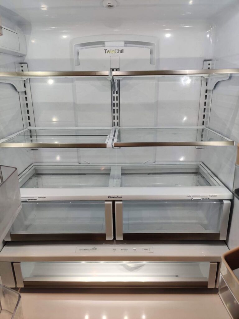 The clean and empty interior of a refrigerator after deep cleaning by Rebeccas Customized Cleaning LLC in Reading, PA.