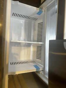 A sparkling clean refrigerator interior, showcasing house cleaning services by Sara's House Cleaning in Olathe, KS.