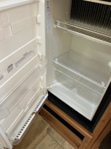 A sparkling clean refrigerator interior after a professional cleaning service by You have it maid in Canton, MI.