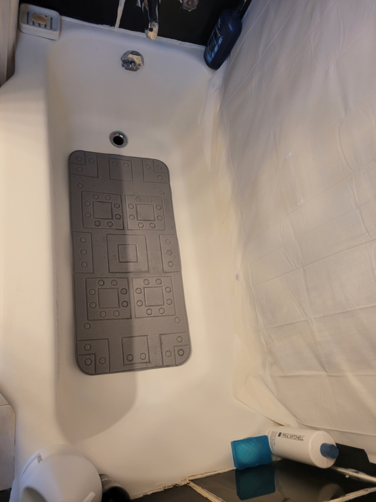 A clean shower and bathtub area after professional cleaning service by Ready.Set.Clean LLC in Morley, MI.