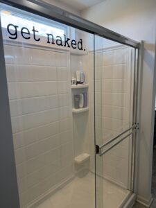 A sparkling clean shower in a bathroom, demonstrating the thorough cleaning services by Messy To Clean in Aurora, IL.