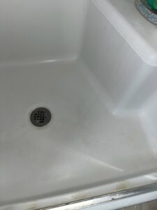 A sparkling clean shower floor after professional cleaning by No Stress Cleaning Services in Virginia Beach, VA