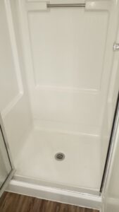 A clean and sanitized shower stall after professional cleaning by By Grace Cleaning Solutions, LLC in Cincinnati, OH.