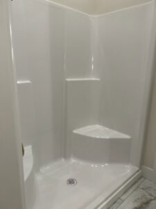 A pristine white shower stall, professionally cleaned by Martinez Cleaning Services in Kent, WA