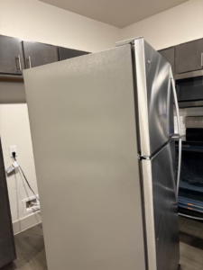 A clean stainless steel refrigerator, polished to perfection by Jess Cleaning in San Antonio, TX.