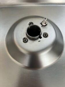 A close-up of a clean stainless steel stove burner, expertly cleaned by Sage & Soap Cleaning Co in Kansas City, MO.