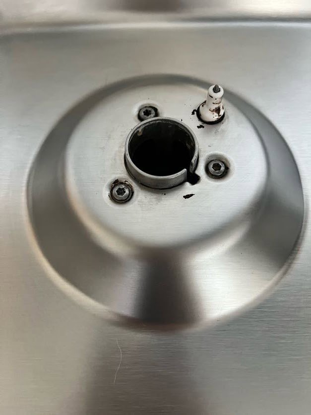 A close-up of a clean stainless steel stove burner, expertly cleaned by Sage & Soap Cleaning Co in Kansas City, MO.