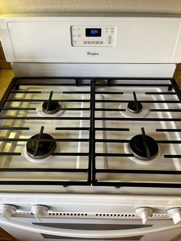A gleaming stainless steel stove top, thoroughly cleaned by Sage & Soap Cleaning Co in Kansas City, MO.