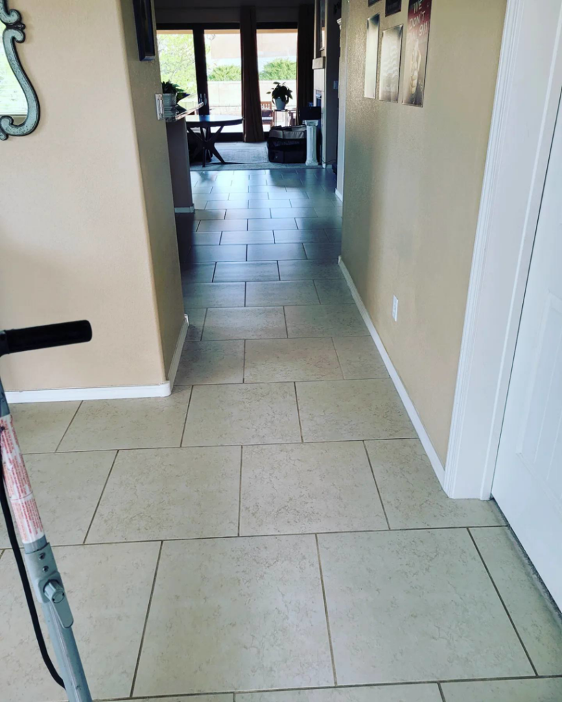 A sparkling clean tiled hallway in a home, showcasing professional floor cleaning by All Clean N Brite LLC in Rio Rancho, NM.