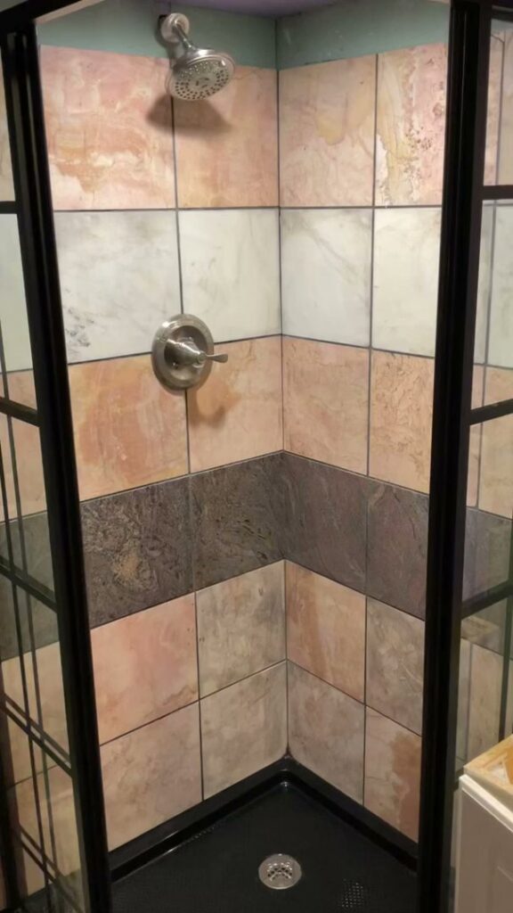 A meticulously cleaned tiled shower stall, reflecting the quality house cleaning from Ragin Cleaning Services in Owings Mills, MD.