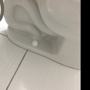 The meticulously clean base of a toilet in a bathroom, cleaned by Magic Maids in Bremen, AL.