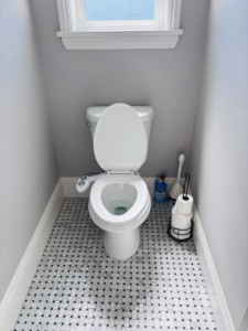 A sparkling clean toilet and tiled bathroom floor, showcasing the results of Clean departure Cleaning service in Reseda, CA.
