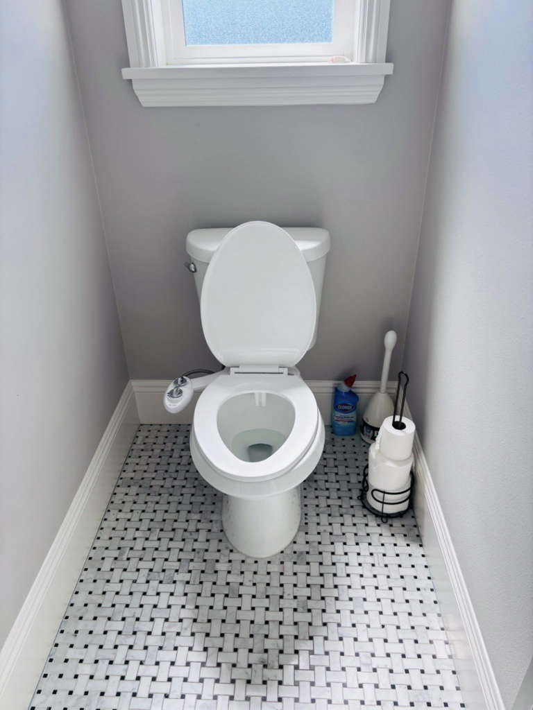 A sparkling clean toilet and tiled bathroom floor, showcasing the results of Clean departure Cleaning service in Reseda, CA.