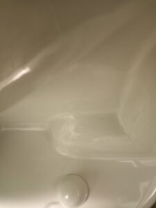 A close-up of a sparkling clean toilet bowl after professional cleaning by Core Needs Janitorial in Indianapolis, IN.