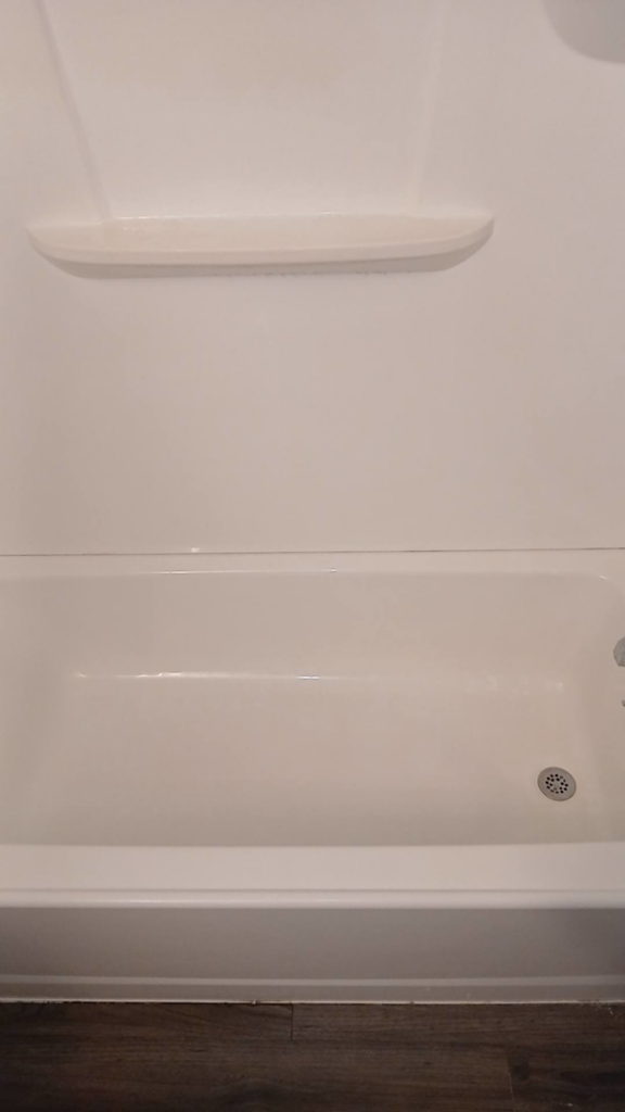 A sparkling clean white bathtub, showcasing the quality house cleaning services by On Point Cleaning Authority in Dayton, OH.