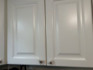 Clean white kitchen cabinets, showing the polished finish achieved by Wilkie Wonders Cleaning in Akron, OH.