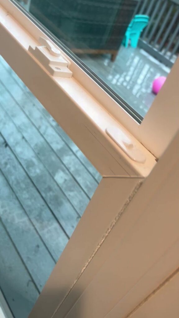 A close-up of a sparkling clean window frame and glass, showcasing attention to detail by Royal Madam Cleaning LLC in Charlotte, NC.