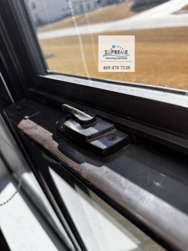 A close-up of a clean window frame and glass, highlighting window cleaning services by Supreme Cleaning Services in Farmers Branch, TX.
