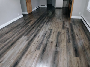 A clean wood-look laminate floor in a home cleaned by Sanchez Cleaning Service, LLC in San Antonio, TX.