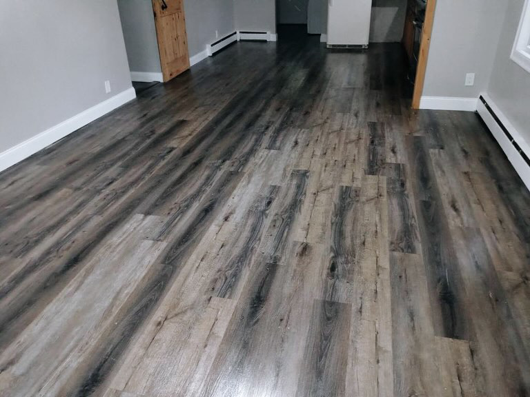 A clean wood-look laminate floor in a home cleaned by Sanchez Cleaning Service, LLC in San Antonio, TX.