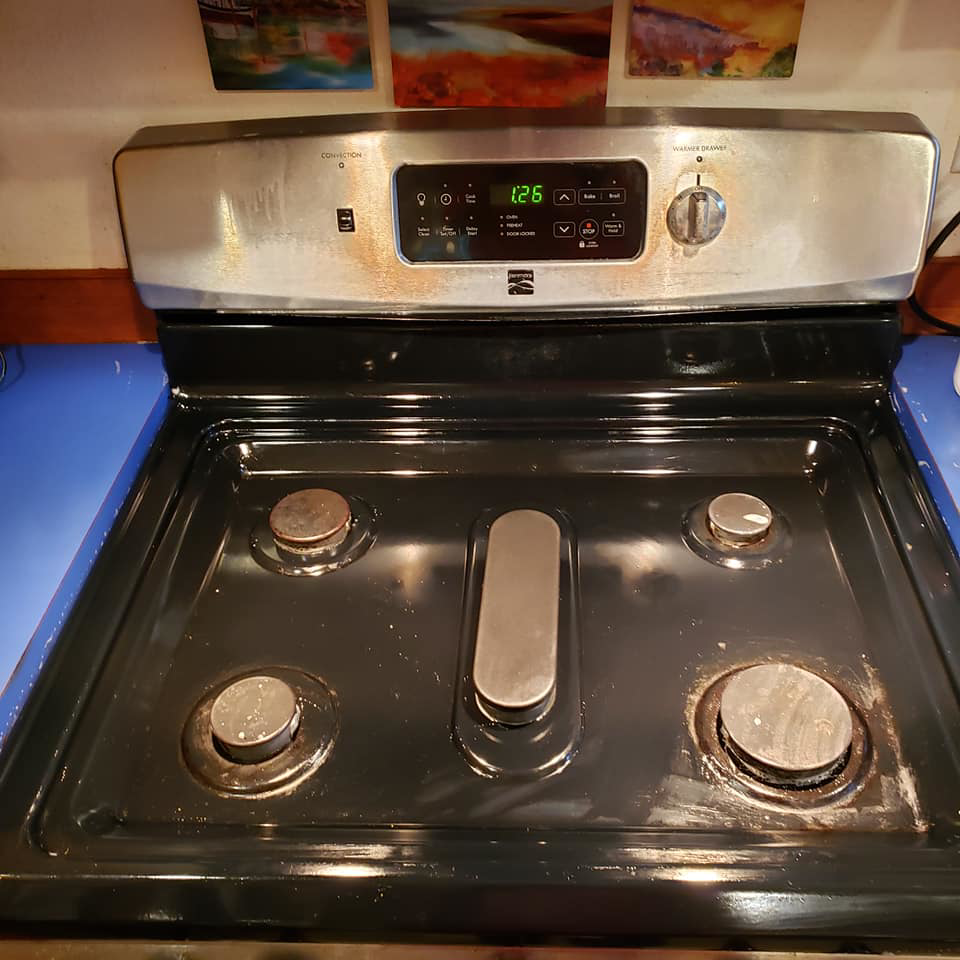 A thoroughly cleaned stovetop and control panel, showcasing the results of Quickcleanup full service cleaning in Juneau, AK.