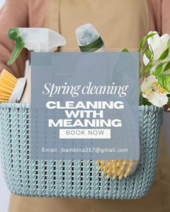 A house cleaner holding a basket filled with various cleaning supplies and fresh flowers from Cleaning with Meaning in Buffalo, NY.