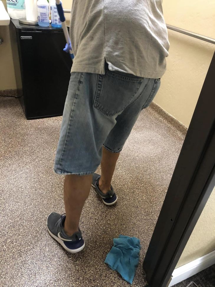 A cleaner wearing gloves mopping a floor, demonstrating house cleaning services by Alma's Cleaning Services in Sacramento, CA.