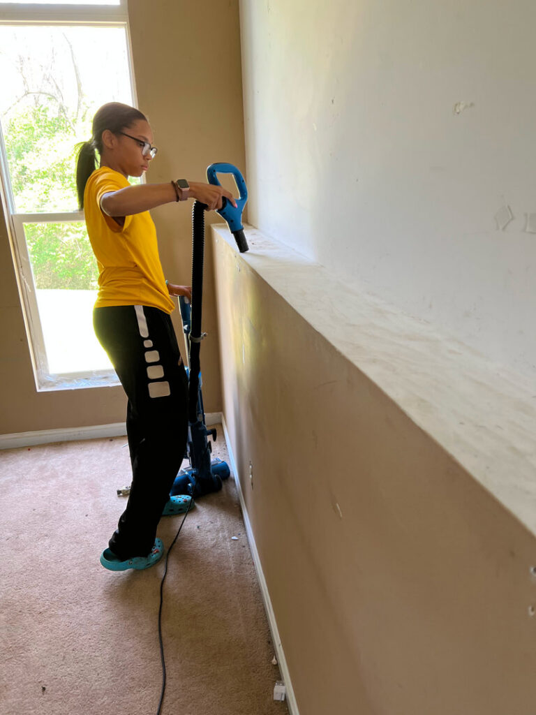 A cleaner from Gem City Commercial and Residential Cleaning using a carpet steam cleaner in a residential room in Dayton, OH